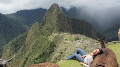 Against a llama in Machu Picchu.