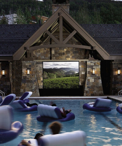 Floating in a swimming pool movie theater.