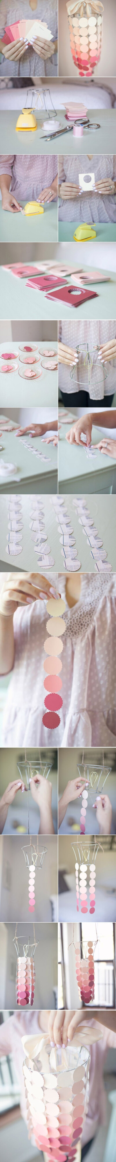  像微风吹过摇逸的风铃，像画家随意勾勒的流线体，也像童年世界中素描本上记录的成长的花朵，但它其实不是植物，也没有声音，更不具功能，它只是一些普通的纸品组合上一个废弃的灯罩的小挂饰，但它却如花的姿态般盛…