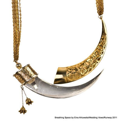 'Kirpan-Necklace' Traditionally, a 'Kirpan' is a small sword worn on the body as a religious symbol for the Sikhs - a warrior race that originated to protect oppressed communities from the Mughal rule…