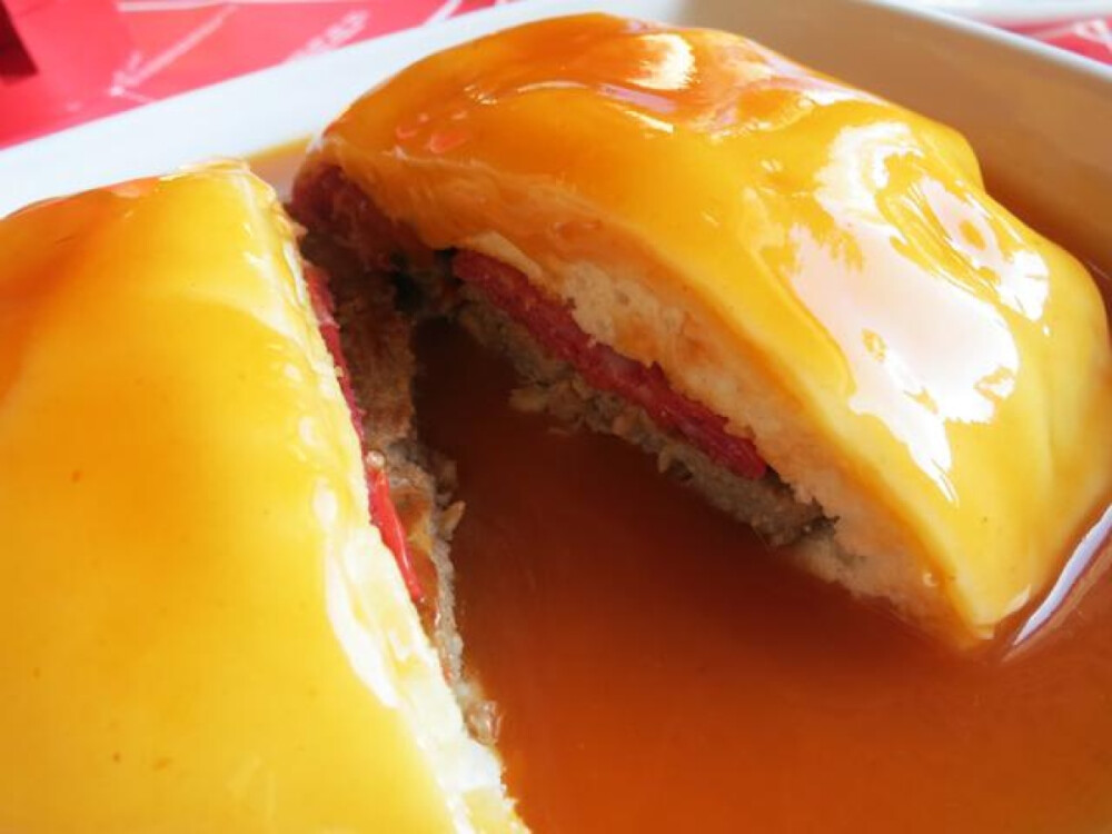 This massive sandwich contains tons of roast meat sandwiched between two slices of breads. It is covered with melted cheese and drenched in a tasty tomato and beer sauce. The Francesinha serves as a hearty meal that I can never finish on my own.