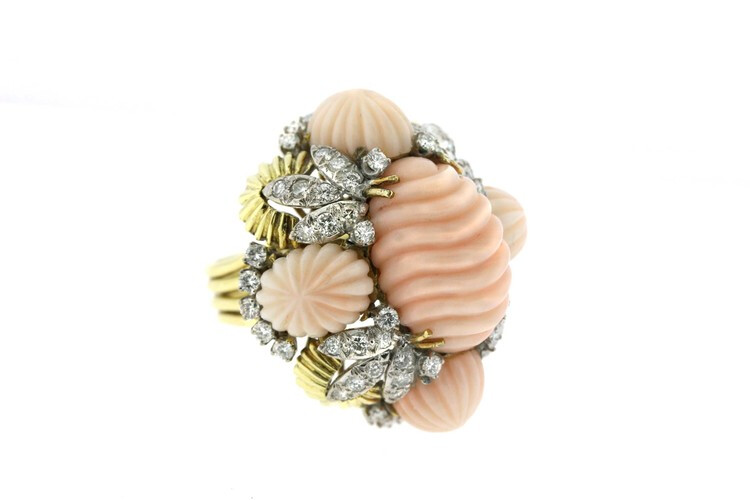 Hammerman Brothers 18k gold cocktail ring with a chunky, bold and organic presence. A real statement piece from the 1960s designed as a large carved coral center surrounded by four matching stones and leaf-like clusters of diamonds.