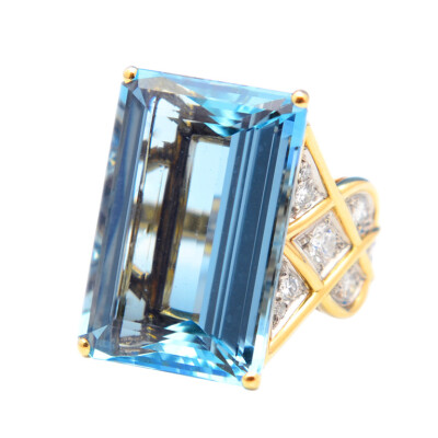 Cartier London Impressive Aquamarine Diamond Gold Ring 18 karat yellow gold, aquamarine and diamond ring by Cartier London, set in the center with an emerald-cut aquamarine measuring 24.02 by 16.39 by…