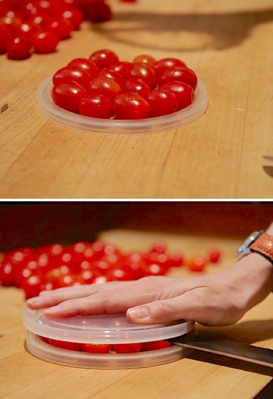 31. Cherry Tomato Hack I usually just pop these in whole, but if you are using them for a salad or other dish, here is a trick using 2 plastic lids to cut them quickly! Make sure you are using a large, sharp knife.