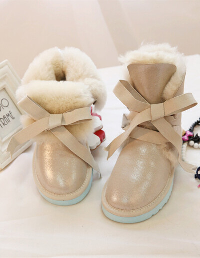 澳洲羊毛一体女雪地靴保暖时尚中筒绑带蝴蝶结甜美