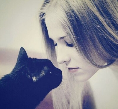 Black Cat and beaautiful owner.