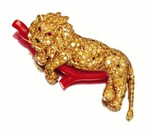 Van Cleef &amp;amp; Arpels New York, Lion Brooch. 18 Karat Gold, Fancy Col­ored Dia­mond, Coral and Ruby.