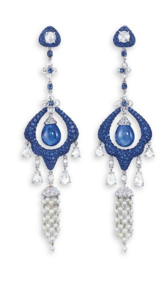 A PAIR OF SAPPHIRE, DIAMOND AND SEED PEARL EAR PENDANTS, BY CARNET EACH SET WITH A SAPPHIRE DROP WITH A CIRCULAR ROSE-CUT DIAMOND CAP, WITHIN A STYLIZED FRAME PAVé-SET WITH CIRCULAR-CUT SAPPHIRES, SUSPENDED FROM A LINE OF FLORAL MOTIFS SET WITH DIAMOND RO