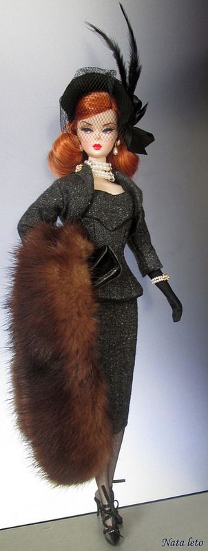 Flickr Silkstone Barbie, A Red haired shoulder length hair Barbie with Grey tweed suit, Black hat with feathers, black heels, black gloves and pearl jewelry.