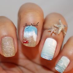 Hit the waves with this adorable looking and beach inspired nail art design! The colors are warm and calm, combining white and blue shades to recreate the waves and using gold glitter for the sand. The crab accent is also a great way to add to the cuteness of this fabulous summer nail art design.