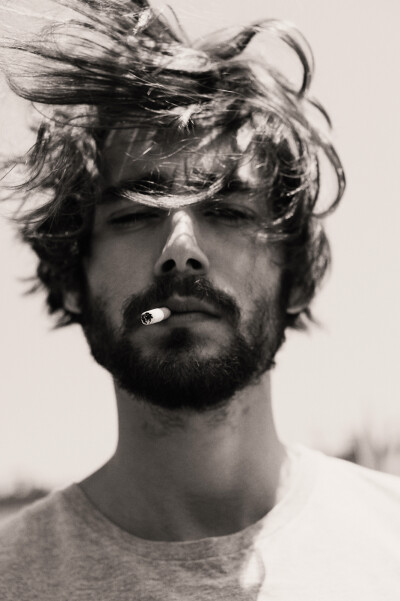 For some reason a guy with a cigarette hanging from his mouth always makes him significantly hotter....