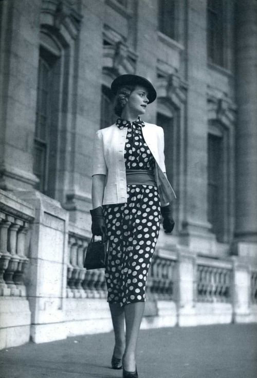 1930s Fashion: Polka-dot dress with light jacket.