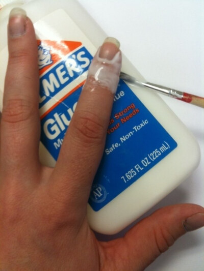 Apply Elmer’s glue with a thin paint brush, which peels off to reveal a perfect manicure. | 33 Easy Nail Hacks For A Flawless DIY Manicure