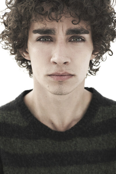 Robert Sheehan's curly hair gives him a mercurial flair (free rhyme on us) | Curly Hair Ideas For Guys