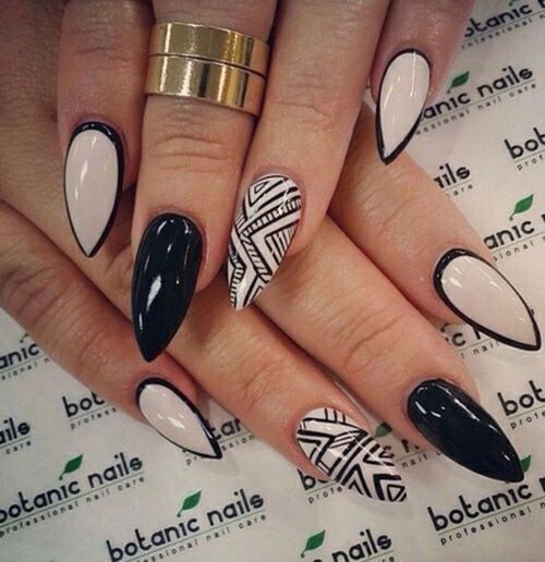 Not down with the pointy nails, but the black outlined nude nails are super cool!