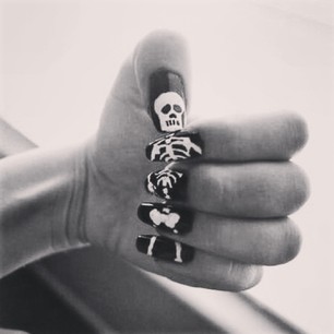 A nail-by-nail skeleton. | 27 Delightfully Spooky Ideas For Halloween Nail Art