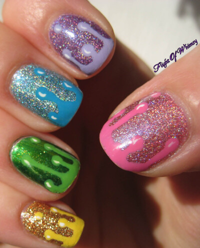 Dripping rainbow nail art with holographic polish too