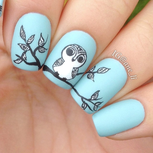 Pastel Blue, Black, and White Nails With Tribal Style Owl Art