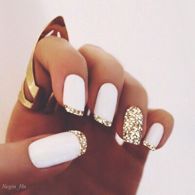 Super stylish nail art! White matte polish &amp;amp; gold glitter french tips nail design. #frenchtips #naildesign