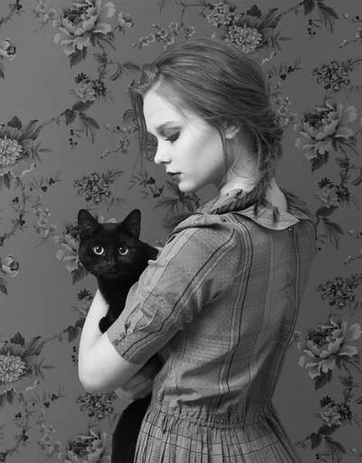 Girl and black cat