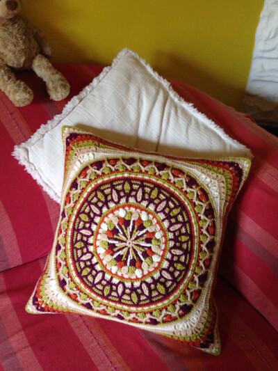 http://www.ravelry.com/patterns/library/dandelion-mandala-overlay-crochet