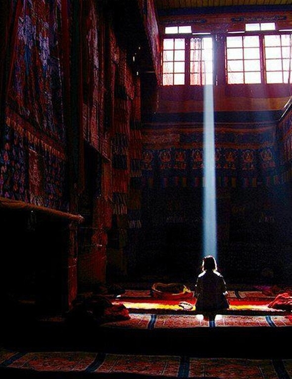 meditating in a ray of light.