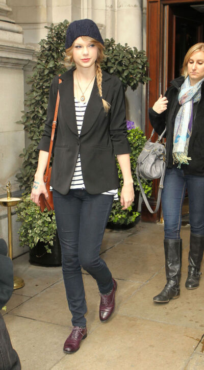 LEAVING THE BEHIHANA RESTAURANT IN LONDON, ENGLAND-MARCH 21ST