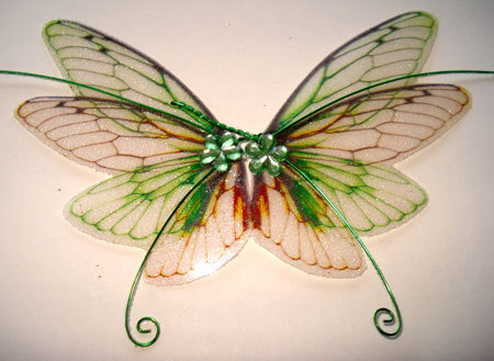 OOAK Fairy Pixie Fantasy Art Doll Wings ADSG IADR ( picture was found on the Esty shop: IndigoMoonWings)
They are made using high quality transparent film and are embellished with glitter and gems.
The backs are dusted with ultra fine iridescent fairy glitter which makes them sparkle and shimmer in