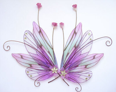 OOAK Fairy Pixie Fantasy Art Doll Wings ADSG IADR ( picture was found on the Esty shop: IndigoMoonWings)
They are made using high quality transparent film and are embellished with glitter and gems.
T…