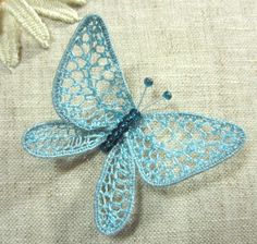 3-D lace embroidered butterfly. I must admit I haven't looked at the
tutorial yet but assume it is done using the same method as the