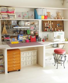 creative sewing room space with lots of craft storage- yes
please....love the use of barn wood on wall