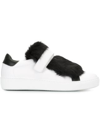 Black and white leather and rabbit fur 'Lucie' sneakers from Moncler featuring a round toe, a velcro fastening and a flat rubber sole.
