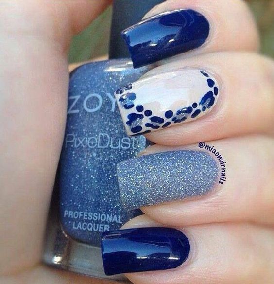 A strong combination of blue colors and designs. Each nail sports a unique design from matte to glitter and to leopard prints.: