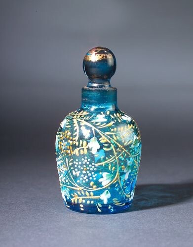 Moser Bohemian mini perfume bottle, circa 1900s, in turquoise crystal, with raised enamel details.