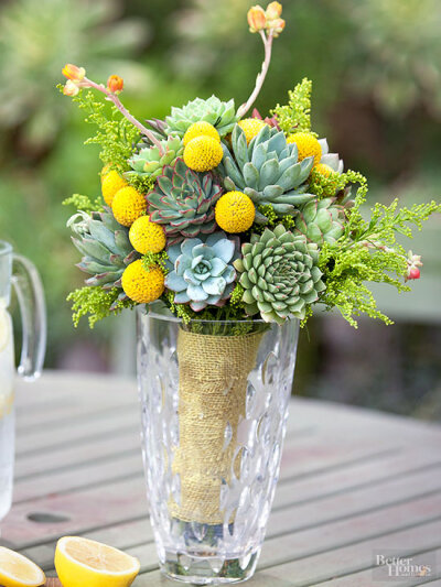 Bright yellow ball flowers add shape and pops of color to this green bouquet. We used Billy Ball flowers here to create the look.