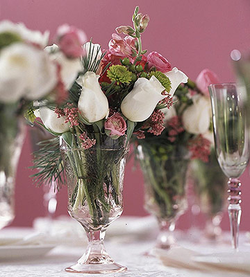 Create a special centerpiece with small arrangements in pink Depression glass goblets.