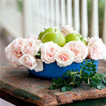 Unlikely Pairs Think outside traditional flower arrangement elements and pair roses with objects according to shape and color. --Nestle pretty green apples in between the stems of lush pink roses. --C…