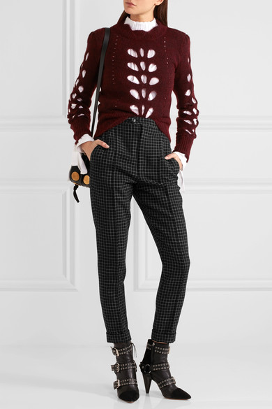 Isabel Marant 2016 秋冬系列以朋克和 1980 年代法国偶像 Edwige Belmore 为灵感设计而成。这条秀场款锥形裤由格子羊毛斜纹布制成，剪裁利落帅气。高腰和正面压痕细节则能在视觉上拉伸腿长。