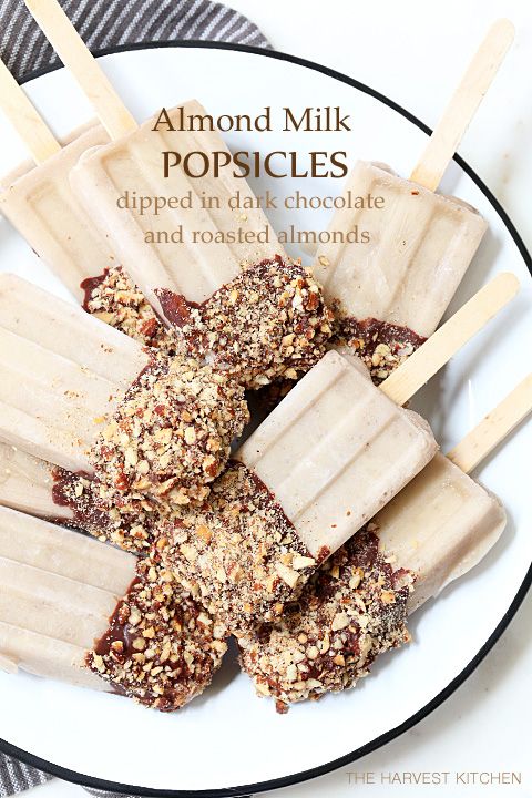 You can eat all of these Healthy Almond Milk Popsicles you want this summer! They're made with almond milk and bananas and they're dipped in heart healthy dark chocolate and roasted almonds.: