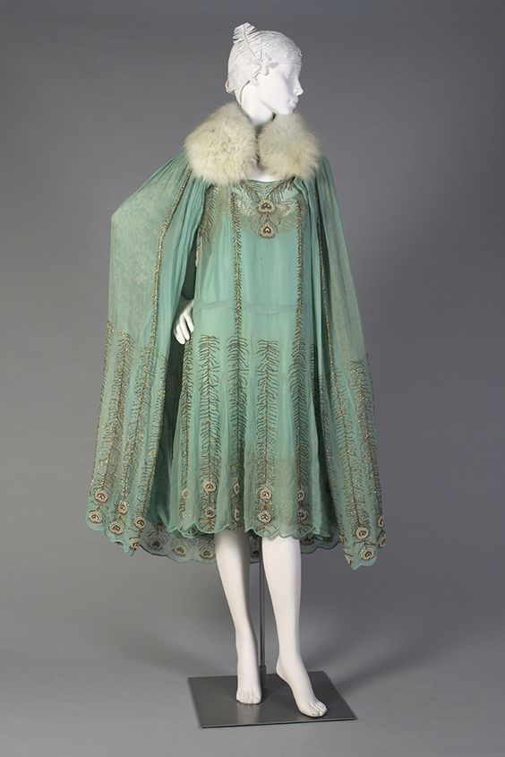 1920s, America - Teal chiffon and gold evening dress and cape with fur collar