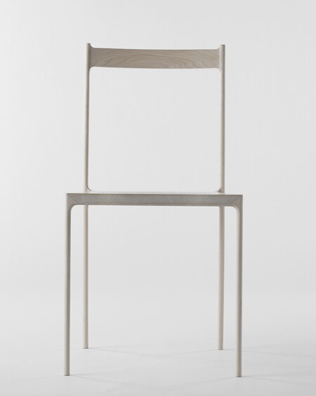 Japanese designers Nendo have created a chair made of hollowed-out pieces of wood covering a metal frame.