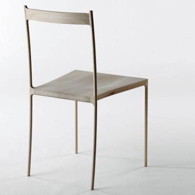 Japanese designers Nendo have created a chair made of hollowed-out pieces of wood covering a metal frame.