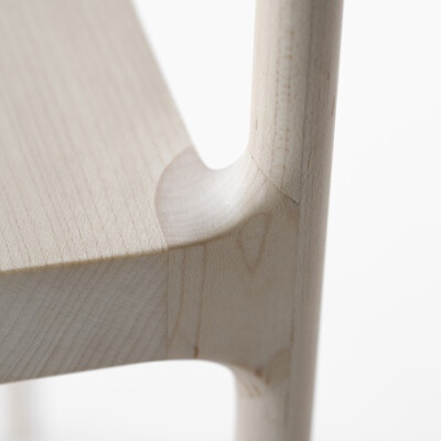 Japanese designers Nendo have created a chair made of hollowed-out pieces of wood covering a metal frame.