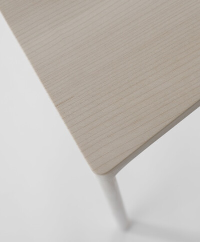 Japanese designers Nendo have created a chair made of hollowed-out pieces of wood covering a metal frame.