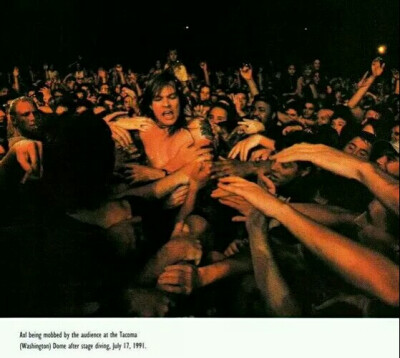 Crazy fans're touching Axl Rose.
