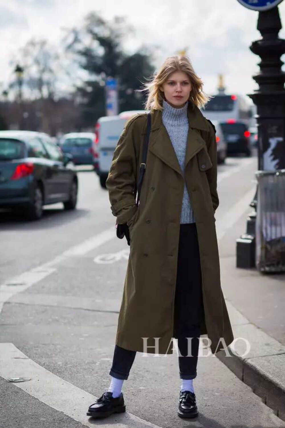 Blue turtle neck sweater+ army green coat+ black trousers+ purple sock+ loafers 