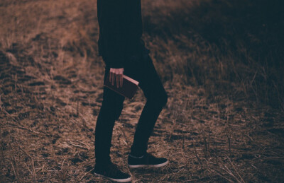 Low Section of Man Standing on Grass