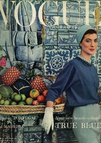 UK VOGUE cover - January 1957 - blue portuguese tile and fresh and tasty fruits from Madeira. Model is wearing a creation by Givenchy. Story: Spring in Portugal and Madeira.