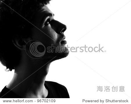 young man looking up portrait silhouette in studio isolated on white background