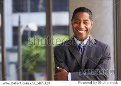 Middle aged black businessman looking at camera